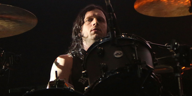 An injury to Nathan Followill after a tour bus crash has forced Kings of Leon to postpone a concert. Photo/Getty