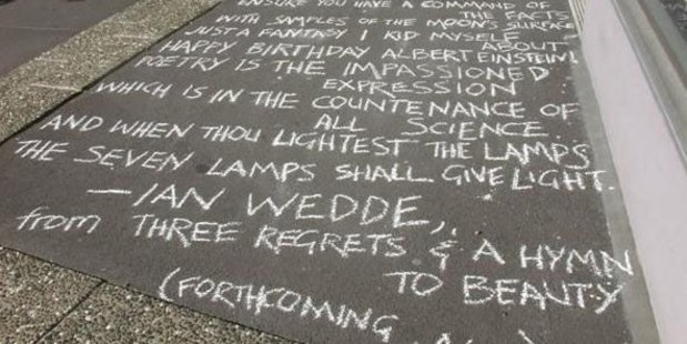 An Ian Wedde poem written in chalk on a city footpath for National Poetry Day in 2010.