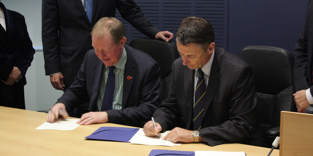 Housing Minister Nick Smith and Tauranga Mayor Stuart Crosby sign the housing accord tonight.