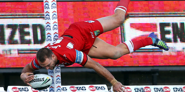 The Dragons' Jason Nightingale scores his second try during the NRL match between the Canberra Raiders and the St George Illawarra Dragons in Canberra. Photo / Getty Images