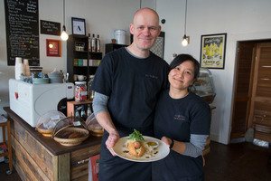 Matthias and Pui Kraemer from Kramer Cafe with the German pork sausage dish. Photo / Peter Meecham.