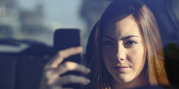 A survey has found that one in four young people in Europe have taken a selfie while driving. Photo / Getty Images