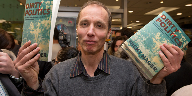 Author Nicky Hager with copies of his book, Dirty Politics, at the launch in Wellington. Photo / Mark Mitchell