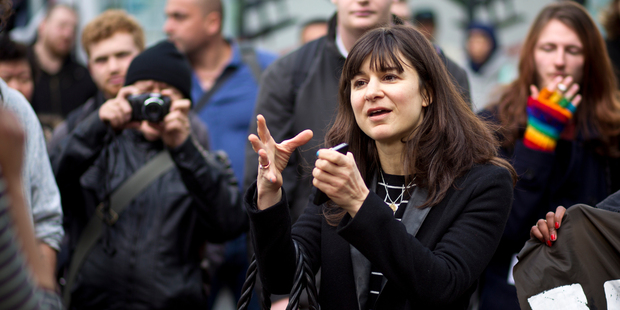 Juliet Moses stands up to protestors outside the NZ Super Fund office in Auckland. Photo / Dean Purcell