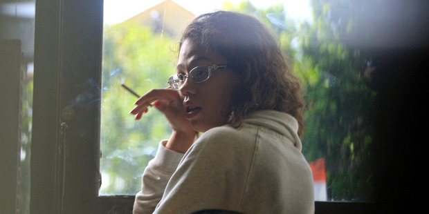 Heather Mack, stands at the police district headquarters after she was brought in for questioning in relation to the death of her mother in Bali, Indonesia. Photo / AP