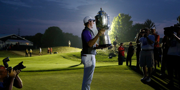 Rory McIlroy, of Northern Ireland, holds up the Wanamaker Trophy after winning the PGA Championship golf tournament at Valhalla Golf Club on Sunday. Photo / AP