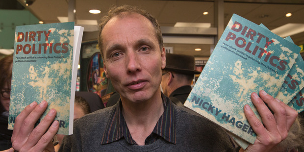 Author Nicky Hager surrounded by media at the launch of his book, Dirty Politics. Photo / Stuart Munro