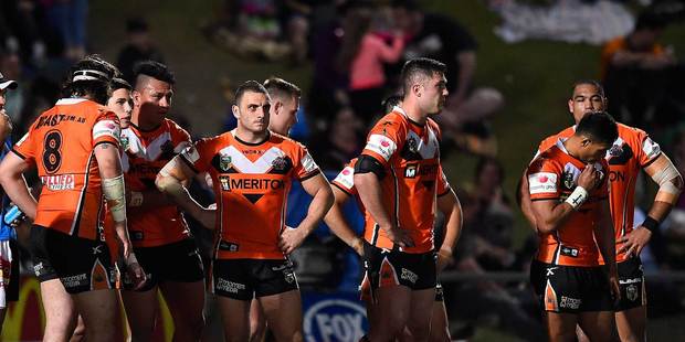 Wests Tigers players look dejected during their 64-6 loss to the North Queensland Cowboys in Townsville on Saturday. Photo / Getty Images