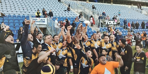 The victorious Otangarei Knights celebrate with the RLN trophy.