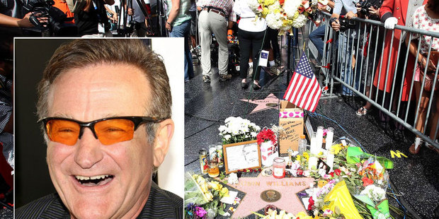 Fans leave tributes for Robin Williams beside his star on the Hollywood Walk of Fame. Photo / AP
