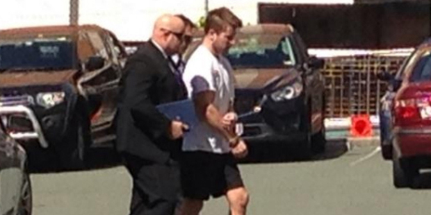 Gable Tostee being taken into custody. Photo / Carrie Greenbank / Channel 9 / Twitter
