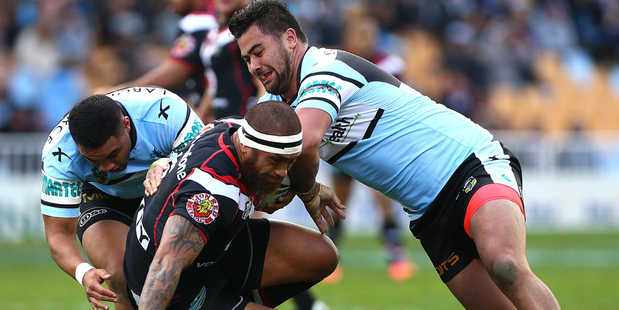 Manu Vatuvei is brought down in a tackle against the Sharks. Photo / Getty Images