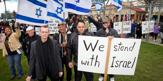 Pastor Nigel Woodley from the Flaxmere Christian Fellowship with Tony McCaw and Riki Kupa during the Standing for Israel rally at Hastings Town Clock on Saturday. Photo / Glenn Taylor