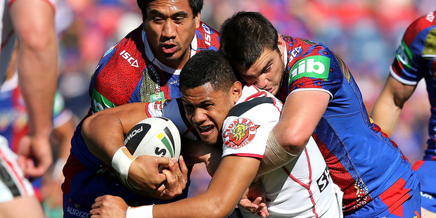 David Fusitua of the Warriors is tackled by Kade Snowden of the Knights during the round 23 NRL match between the Newcastle Knights and the New Zealand Warriors. Photo / Getty Images