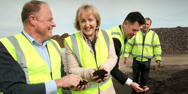 Tukituki MP Craig Foss, Environment Minister Amy Adams, National's Napier candidate Wayne Walford and BioRich owner Mike Glazebrook at the company's Awatoto composting site. PHOTO/WARREN BUCKLAND