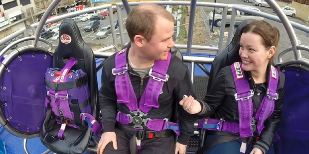 A video still-shot (above) shows the moment Katrina Genefaas proposed to boyfriend Mark Trenberth on the reverse bungy in Auckland.