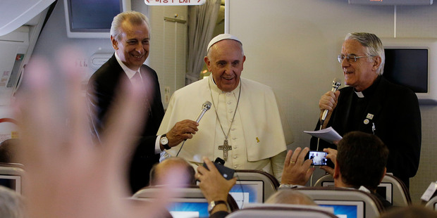 Pope Francis meets the media during an airborne press conference on his journey back to Rome from Seoul. Photo / AP