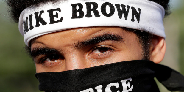 Quentin Baker, from Crystal City, Mo. watches during a protest for Michael Brown. Photo / AP