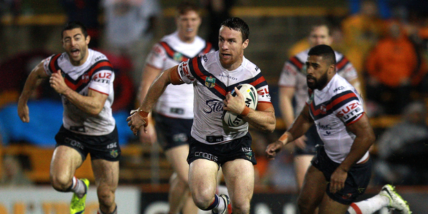 James Maloney of the Sydney Roosters makes a break during his side's big win over the Wests Tigers. Photo / Getty Images