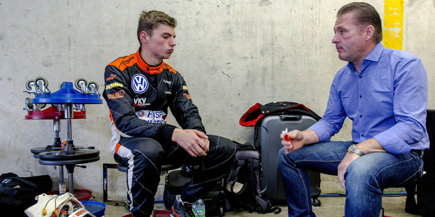 Red Bull's newest recruit to Formula One, Dutch racing driver Max Verstappen, 16, talks things over with his father, former F1 driver Jos Verstappen.Picture / AFP