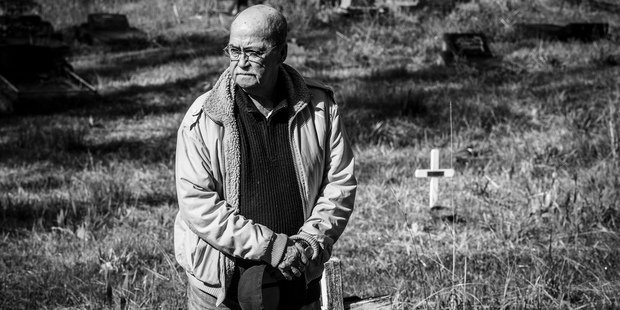 Pooch Quintal at Waikumete cemetery, looking for the unmarked grave of his friend Albert Black. Photo / Getty Images
