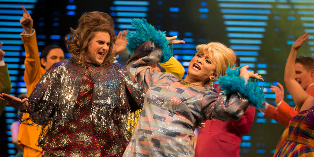 Colourful costumes and the performance of Lavinia Williams, centre, are among the many highlights of this updated version of Hairspray . Photo / Peter Meecham