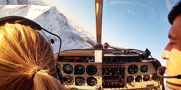 Elizabeth Carlson (left) takes a flying lesson over Wanaka. Photo / Elizabeth Carlson