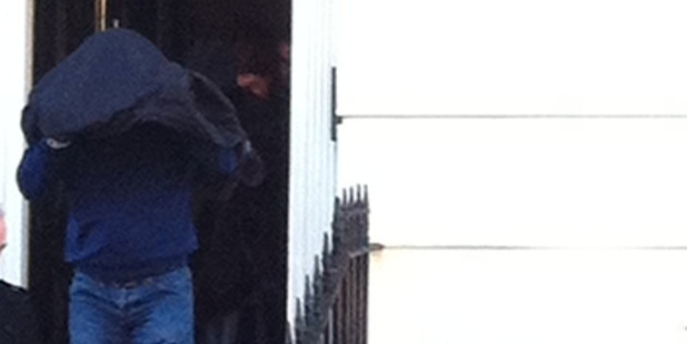 Tommy Adams, brother of Terry, is escorted from his Clerkenwell home during Operation Octopod raids by police. Items seized in February and April included firearms, large amounts of cash, art and jewellery.