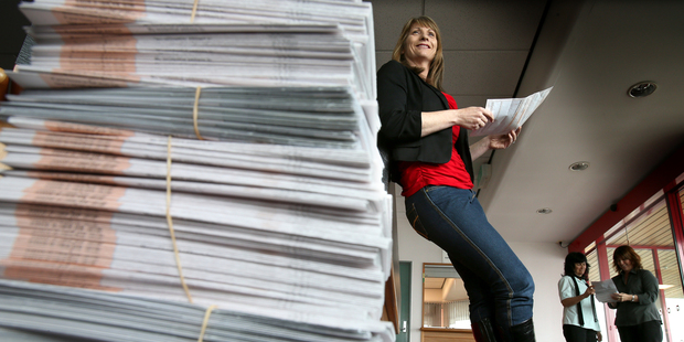 Tauranga Electoral Office registrar Lesley Christophers sorting through a pile of electoral forms. PHOTO/ANDREW WARNER