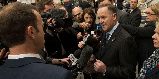Prime Minister John Key during his visit to the NZ Customs Air Cargo Inspection Facility at Auckland International Airport today. Photo / Brett Phibbs
