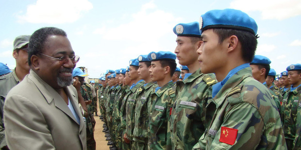 Joint AU-UN special representative Rodolphe Adada greets Chinese engineering unit members in Nyala. Photo / AP