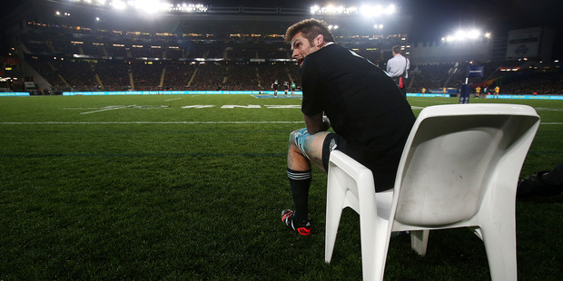 Richie McCaw sits on the sideline after being yellow carded. Photo / Getty Images