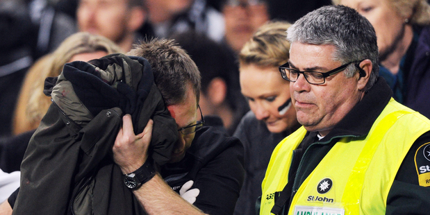 One of the injured spectators who was taken away bleeding. SNPA Photo / Ross Setford