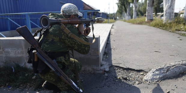 A pro-Russian rebel takes his position outside Donetsk, eastern Ukraine. Photo / AP