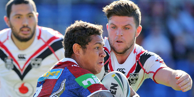 Dane Gagai of the Knights is tackled by Chad Townsend. Photo / Getty Images