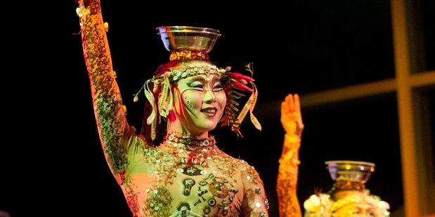 Performers from Cirque du Soleil's Totem entertain the crowd at the opening ceremony last night.