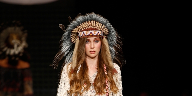 A model showcases a Trelise Cooper design with a feathered headdress. Photo / Getty Images