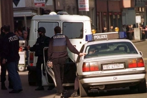 Police at the scene of the slaying in Basel, Switzerland in 2000.