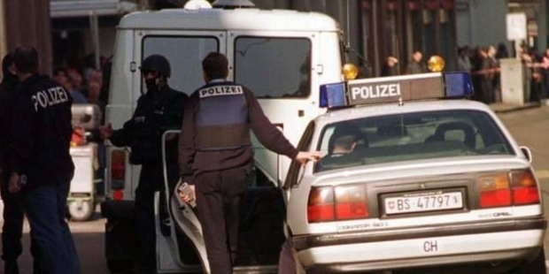 Police at the scene of the slaying in Basel, Switzerland in 2000.