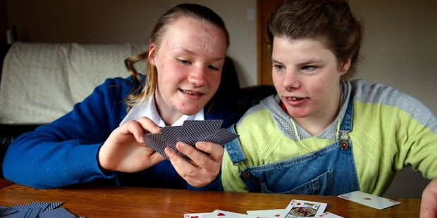 HELPING HAND: Claudia Cooke (left), 15, is calling for trials of medical marijuana to help her sister Kristal, who has severe epilepsy. PHOTO/JOHN STONE
