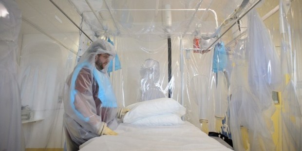 A shows a nurse wearing protective clothing as he demonstrates the facilities in place at the Royal Free Hospital in north London, ahead of the Ebola patient's arrival. File photo / AP