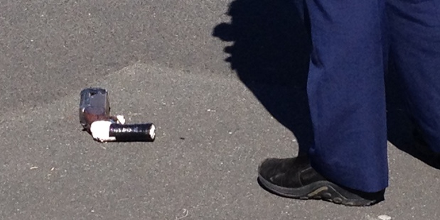 A gun at the scene of the shooting in Hamilton. Photo / Christine Cornege