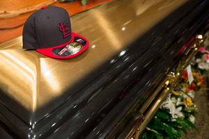 A St. Louis Cardinals baseball at rests on top of Michael Brown's casket before the start of his funeral at Friendly Temple Missionary Baptist Church in St. Louis. Photo / AP