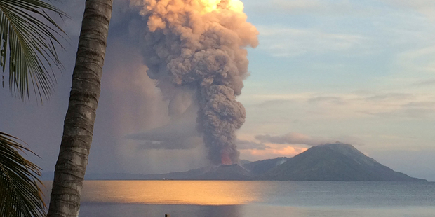 Smoke billows from Mt Tavurvu after an eruption yesterday, forcing the evacuation of communities. Photo / AP