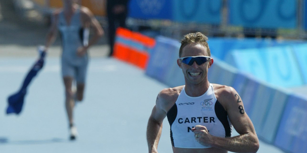 Hamish Carter crosses the finishline to win the 2004 Olympic triathlon, with compatriot Bevan Docherty taking out the silver. Photo / Mark Mitchell