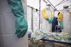 NGO workers at an Ebola training session with a mannequin in Brussels. Photo/ AP