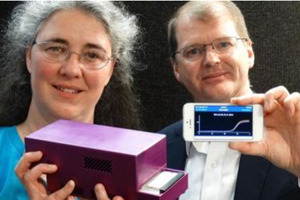 Dr Jo-Ann Stanton and Paul Pickering with a handheld DNA diagnostic unit, connected to a smartphone, unveiled in Queenstown yesterday. Photo by David Williams.