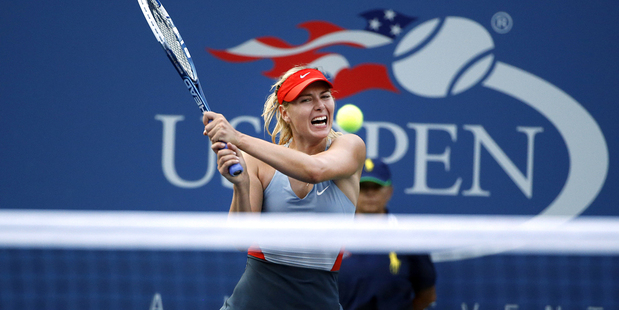 Maria Sharapova, of Russia, returns a shot to Alexandra Dulgheru, of Romania. Photo / AP