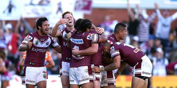 Manly's players celebrate their last-minute win over Penrith at Brookvale Oval in Sydney. Photo / Getty Images