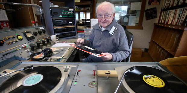 Neil Walsh belts out the hits from yester-year in the studio of Village Radio. Photo / John Borren